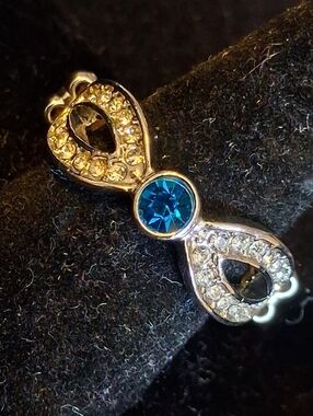 Paparazzi Silvertone Ribbon Ring with Turquoise Colored Rhinestone Accent